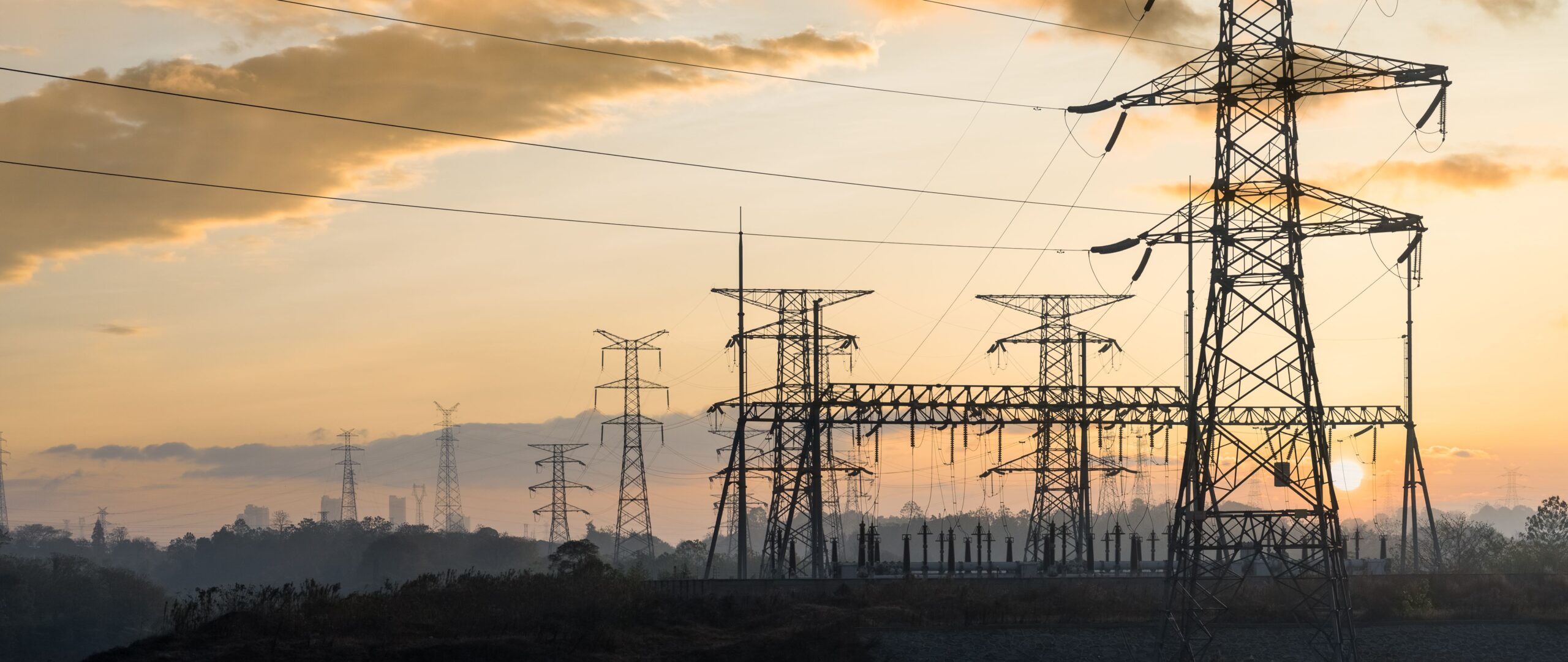 electricity transmission pylon at dusk, electric substation in sunset